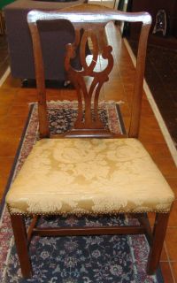 ANTIQUE MAHOGANY SIDE CHAIR Lovely Antique Mahogany Side Chair. Circa early 1900's. Measures 38-1/2" tall x 22" wide x 20" deep. Overall condition is good with minor wear. Fabric is torn slightly. Starting Bid $20. Auction Estimate $20 - $60.
