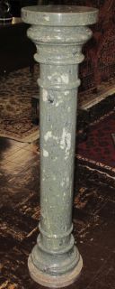 TALL GREEN MARBLE PEDESTAL Tall Green Marble Pedestal. Measures 47-1/4" tall x 10-1/2" wide. Condition is good. No damage. Starting Bid $150. Auction Estimate $350 - $450. 