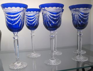6 COBALT BLUE CRYSTAL WINE GLASSES  Beautiful Set of 6 Cobalt Blue Bohemian Cut to Clear Crystal Wine Glasses. Heavy and high quality European Leaded Crystal. Each measure 9" tall. Condition is New, Mint. No Damage. Starting Bid $160 for all 6. Auction Estimate $200 - $250. 