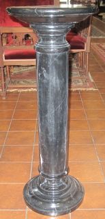 TALL BLACK MARBLE PEDESTAL Tall Black Marble Pedestal. Measures 36" tall x 14" wide. Condition is good. No damage. Starting Bid $150. Auction Estimate $350 - $600. 
