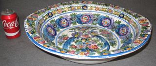 LARGE HAND PAINTED CERAMIC BOWL Large Hand Painted Ceramic Centerpiece Bowl. Measures 4-3/4" tall x 20" wide. Condition is Very good. No damage. Starting Bid $25. Auction Estimate $120 - $200. 
