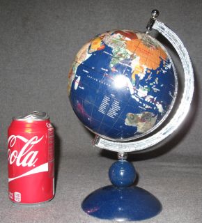 HANDCRAFTED BLUE LAPIS & GEMSTONE GLOBE Small Handcrafted Blue Lapis & Gemstone Globe. Measures 10-3/4" tall x 7" wide. Condition is good. No damage. Starting Bid $20. Auction Estimate $50 - $80. 