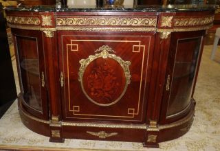LOUIS XVI STYLE CREDENZA with MARBLE TOP Louis XVI Style Credenza with Marble Top and Bronze Ormolu Mounts. Measures 41" tall x 69" wide x 21" deep. Overall condition is very good. No damage. Starting Bid $250. Auction Estimate $450 - $500.	