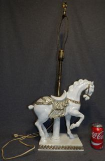 CAPODIMONTE PORCELAIN HORSE TABLE LAMP Vintage Italian Capodimonte Porcelain Horse Table Lamp. Measures 34" tall x 16" wide x 6-1/2" deep. Overall condition is very good. No damage. No shade. Starting Bid $30. Auction Estimate $80 - $120.  
