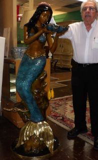 BRONZE MERMAID FOUNTAIN SCULPTURE Beautiful & Colorful Bronze Mermaid Fountain sculpture. Artist signed and Limited Edition Numbered. High Quality Bronze with excellent Detail and patina. Sculpture functions as a Water Fountain Feature as well. Measures 66" tall x 26" wide x 26" deep. Condition is Like New, Mint. No Damage at all. Starting Bid $2,000. Auction Estimate $3,000 - $4,000.   