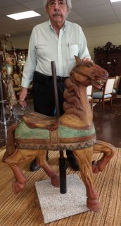 VINTAGE WOODEN CHILDS CAROUSEL HORSE Vintage Wooden Childs Carousel Horse on a Marble stand. Measures 44" tall x 37" wide. Condition is good to fair. Some Wear. Not original base. Starting Bid $250. Auction Estimate $450 - $600.    