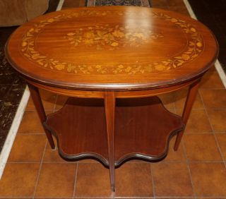 INLAID MAHOGANY SIDE TIER TABLE Vintage Inlaid Mahogany Side Tier Table. Measures 29" tall x 31" wide x 22" deep. Overall condition is very good. No damage. Starting Bid $80. Auction Estimate $150 - $200.  