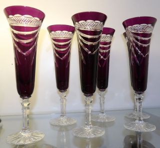 6 AMETHYST CUT CRYSTAL CHAMPAGNE GLASSES Beautiful Set of 6 Bohemian Style, Amethyst Cut to Clear Crystal Champagne Glasses. Heavy and high quality European Leaded Crystal. Each measure 9" tall. Condition is New, Mint. No Damage. Includes Original Fitted Box. Starting Bid $160 for all 6. Auction Estimate $200 - $250.