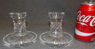 WATERFORD CRYSTAL "LISMORE" CANDLESTICK CANDLE HOLDERS Pair of Waterford Crystal "Lismore" Candlesticks. Each measures 3-3/4" tall x 4-1/4" wide. Overall condition is very good. No damage. Starting Bid $40. Auction Estimate $60 - $80.  