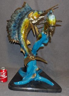 BRONZE SAILFISH & MAHI MAHI SCULPTURE Bronze Sailfish & Mahi Mahi Sculpture on a Marble Base. Artist Signed & Numbered. High Quality Bronze with excellent Detail and patina. Measures 29" tall x 24" wide x 17-1/2" deep. Condition is Like New, Mint. No Damage at all. Starting Bid $1,000. Auction Estimate $1,500 - $2,000. 