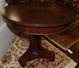 EMPIRE STYLE MAHOGANY SIDE TABLE Empire Style Mahogany Side Table. Measures 30" tall x 30" wide. Overall condition is good. Minor surface wear. No damage. Starting Bid $150. Auction Estimate $200 - $300.   