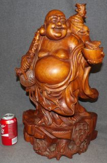 CARVED TEAK WOOD HAPPY BUDDHA SCULPTURE Large, Carved Teak Wood Happy Buddha Sculpture. Measures 22-1/2" tall x 13" wide x 7-1/2" deep. Overall condition is very good. No damage. Starting Bid $200. Auction Estimate $350 - $500.  