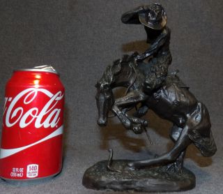 VINTAGE BRONZE RATTLESNAKE after FREDERIC REMINGTON Vintage, Western Bronze Sculpture "Rattlesnake" after Frederic Remington. Signed. Measures 8-1/2" tall x 6" wide. Condition is very good. No Damage. Starting Bid $150. Auction Estimate $250 - $300.     