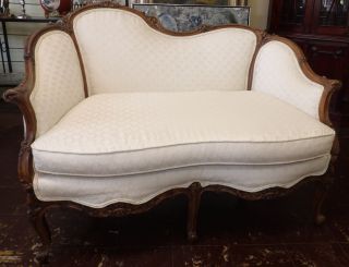 ANTIQUE CARVED FRENCH WALNUT SETTEE Antique Carved French Walnut Settee. Measures 37" tall x 50" wide x 30" deep. Condition is very good. No damage. Starting Bid $350. Auction Estimate $600 - $700.   