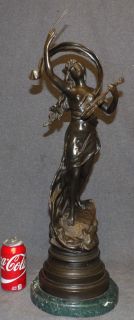 HENRYK KOSSOWSKI VINTAGE BRONZE SCULPTURE "MUSIQUE"  Henryk Kossowski (1855-1921) Vintage Bronze Sculpture. Titled "Musique". Artist Signed. High Quality Bronze with excellent Detail and patina. Measures 26" tall x 8-3/4" wide. Condition is very good. No Damage. Starting Bid $300. Auction Estimate $500 - $600. 