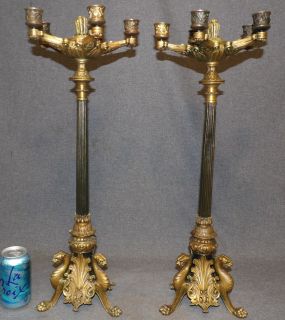 PAIR of ANTIQUE BRONZE CANDELABRAS Pair of Antique Bronze Candelabras. Tall and Heavy. Each measure 24" tall x 8-1/2" wide. Condition is good. No damage. Starting Bid $500. Auction Estimate $750 - $1,000.    