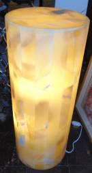ONYX STONE BACKLIT PEDESTAL Contemporary Onyx Stone Backlit Pedestal Lamp. Art Deco Style. Tall, cylindrical shape. Measures 29-1/2" tall x 11-3/4" wide. Condition is New, Mint. No Damage. Starting Bid $250. Auction Estimate $250 - $350.    