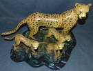BRONZE CHEETAH FAMILY SCULPTURE on MARBLE Bronze Cheetah Family Sculpture on a Black Marble Base. Large and heavy. Cold Painted Bronze Finish.  Signed "Allan Barnes" and dated 2008. Sculpture measures 18" tall x 24" wide x 14" deep. Condition is Brand New, Mint. No Damage at all. This Sculpture is made entirely from Bronze with a Marble Base. Starting Bid $300. Auction Estimate $600 - $750.  