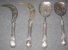 Set of 4 ANTIQUE STERLING SILVER SERVING PIECES Set of 4 Antique Sterling Silver Serving Pieces. 2 Knives and 2 Spoons. Each is 9-1/2" long. Overall condition is good. No damage. Starting Bid $300. Auction Estimate $450 - $500.   