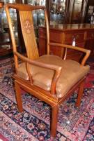 CHINESE MING STYLE TEAK CHAIR by GEORGE ZEE & Co. Chinese Ming Style Horseshoe Chair in Teak by George Zee & Co. Hong Kong. Measures 40" tall x 23" wide x 25" deep. Bottom is Signed. Overall condition is fair with several repairs. Wear consistent with age and use. Starting Bid $30. Auction Estimate $30 - $80.    