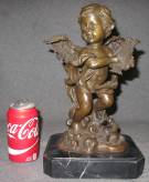 BRONZE CHERUB SCULPTURE on MARBLE Bronze Bust of a Cherub with a Harp on a Black Marble base. Measures 13-1/2" tall. Condition is very good. No damage. Starting Bid $60. Auction Estimate $150 - $200.    