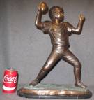 BRONZE BOY FOOTBALL PLAYER SCULPTURE on MARBLE Bronze Boy Football Player Sculpture on a Black Marble Base. Measures 19" tall x 16" wide x 7" deep. Condition is Excellent. Mint. No damage. Starting Bid $250. Auction Estimate $400 - $500.    