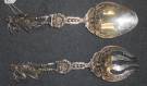 2 STERLING SILVER SERVING Pcs. BROOK & Co. 10 Oz 2 Antique Sterling Silver Brook & Company Figural Serving Pieces. Aprox 10 ounces. Each measures 10". Condition is very good. Minimal wear. No damage. Starting bid $250. Auction Estimate $500 - $700.   