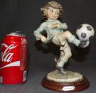 GIUSEPPE ARMANI SOCCER BOY SCULPTURE  Giuseppe Armani Soccer Boy Sculpture. Issued 1982. No Box. Measures 9" tall. Condition is Very good. No damage. Starting Bid $40. Auction Estimate $100 - $150.   