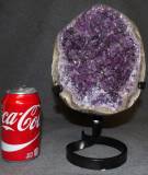 AMETHYST CRYSTAL GEODE on IRON STAND Brazilian Amethyst Crystal Geode on Iron Stand. Measures 12" tall x 7" wide. Condition is Excellent. Mint. No damage. Starting Bid $100. Auction Estimate $300 - $350.  