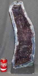 LARGE BRAZILIAN AMETHYST QUARTZ CATHEDRAL Large, Amethyst Quartz Geode Cathedral from Brazil. Very heavy. Weighs over 50 pounds. Measures 25-1/2" tall x 9-1/2" wide x 8" deep. Condition is Excellent. Mint. No damage. Starting Bid $500. Auction Estimate $750 - $1,000.   