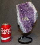 AMETHYST CRYSTAL GEODE on IRON STAND Brazilian Amethyst Crystal Geode on Iron Stand. Measures 11-1/2" tall x 6" wide on stand. Condition is Excellent. Mint. No damage. Starting Bid $120. Auction Estimate $300 - $350.   
