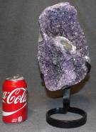 AMETHYST CRYSTAL GEODE on IRON STAND Brazilian Amethyst Crystal Geode on Iron Stand. Measures 13-3/4" tall x 6-1/2" wide. Condition is Excellent. Mint. No damage. Starting Bid $150. Auction Estimate $300 - $350.   
